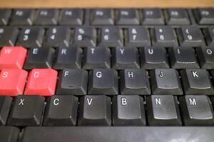 a black computer keyboard, slightly dusty photo