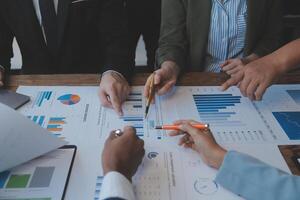 Co working conference, Business team meeting present, investor colleagues discussing new plan financial graph data on office table with laptop and digital tablet, Finance, accounting, investment. photo