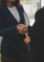 Business handshake for teamwork of business merger and acquisition,successful negotiate,hand shake,two businessman shake hand with partner to celebration partnership and business deal concept photo