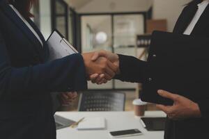 Business handshake for teamwork of business merger and acquisition,successful negotiate,hand shake,two businessman shake hand with partner to celebration partnership and business deal concept photo