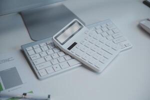 Laptop and paperwork on conference table photo