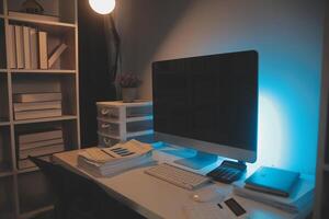 Laptop and paperwork on conference table photo