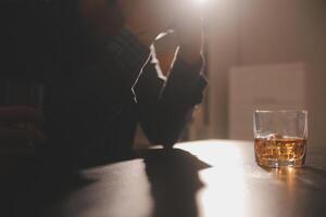 Celebration night, pour whiskey into a glass. Give to friends who come to celebrate photo
