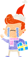 main tiré rétro dessin animé de une homme pleurs portant Père Noël chapeau png