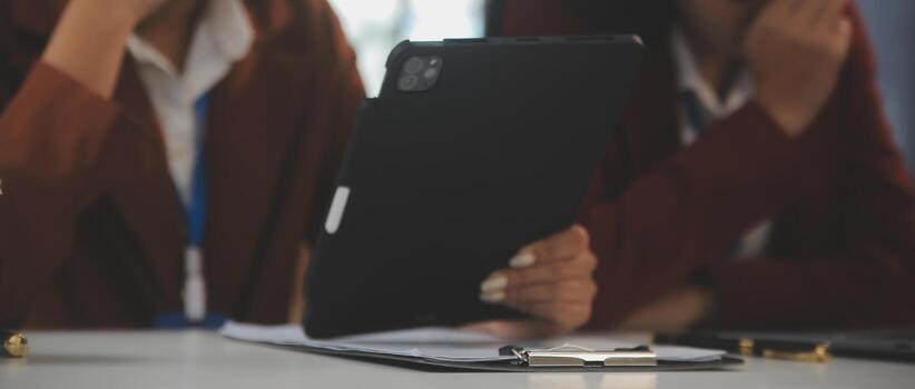 Teamwork with business people analysis cost graph on the desk in the meeting room. The business team discussed meetings and briefing strategies. Negotiation, Analysis, Discussion photo