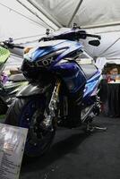 Surabaya, Indonesia. September 8, 2023 - A blue Yamaha Aerox motorbike is displayed at an automotive exhibition photo