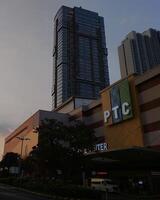 Surabaya, East Java, Indonesia - July 02 2023 - Laviz Apartment building in PTC Pakuwon Trade Center mall with beautiful cloud sky background photo