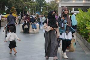 Surabaya - Indonesia, Oct 15 2023 - It can be seen that visitors at Surabaya City Square are very crowded photo