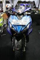 Surabaya, Indonesia. September 8, 2023 - A blue Yamaha Aerox motorbike is displayed at an automotive exhibition photo