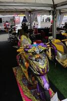 Surabaya, Indonesia. September 8, 2023 - Yamaha Mio motorbike on display at the auto show photo