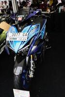 Surabaya, Indonesia. September 8, 2023 - A blue Yamaha Aerox motorbike is displayed at an automotive exhibition photo