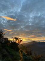Sunrise view from the peak of Mount Bromo, East Java, Indonesia photo