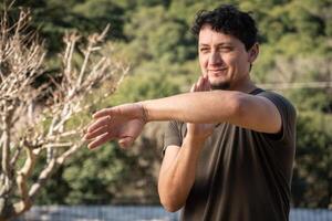 Man Practices Martial Arts in Nature. Copy space. photo