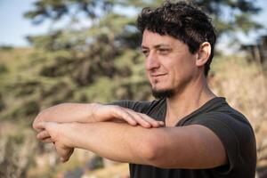 Close-up of a happy man practicing Kung Fu outdoors. photo