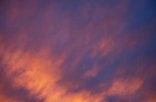 Beautiful scenic orange purple blue cloudscape gloomy cloudy sky background photo