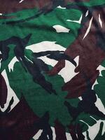 camuflaje sin costura Ejército patrón, modelo textura y militar uniforme antecedentes foto