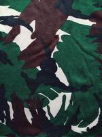 camuflaje sin costura Ejército patrón, modelo textura y militar uniforme antecedentes foto