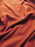 naranja tela fondo, sedoso degradado lujo tela textura, verano textil bandera material tropical ola Mira Moda resumen diseño póster modelo foto