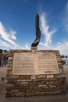 Monterey Harbor Monument with Open Book Design and Feather like Object, California photo