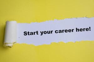 Concept of Start your career here Text written in torn paper. photo