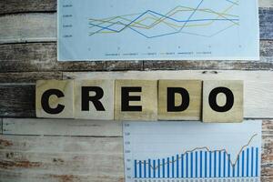 Concept of The wooden Cubes with the word Credo on wooden background. photo