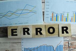 Concept of The wooden Cubes with the word Error on wooden background. photo