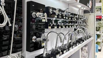 Water taps, kitchen and bathroom faucets display in Ace Store Bekasi. Ace was founded in of United States in 1931. Bekasi, Indonesia, May 1, 2024 photo