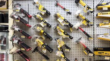 shelf with power tools in the store Ace hardware. Necessary tools for small repairs in everyday life. Bekasi, Indonesia, May 1, 2024 photo