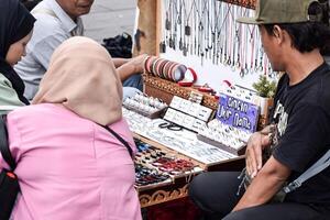 antique ring jewelry and antique knickknacks for sale at the old city flea market, North Jakarta. Jakarta, Indonesia, May 1, 2024 photo