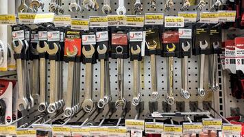 shelf with power tools in the store Ace hardware. Necessary tools for small repairs in everyday life. Bekasi, Indonesia, May 1, 2024 photo