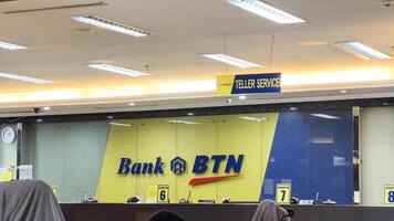 Signboard name of Bank BTN. trading as Bank BTN, is an Indonesian commercial bank best known as a mortgage bank. Bekasi, Indonesia, May 1, 2024 photo