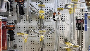 shelf with power tools in the store Ace hardware. Necessary tools for small repairs in everyday life. Bekasi, Indonesia, May 1, 2024 photo