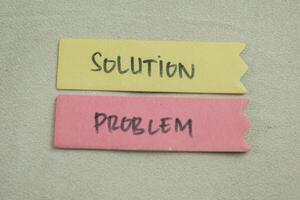 Concept of Solution Problem write on sticky notes isolated on Wooden Table. photo