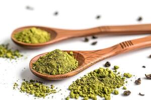 Two wooden spoons with ground dry green tea powder, green matcha powder, antioxidant, superfood photo