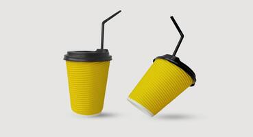 Two paper disposable yellow glasses levitate on a light background. Concept of recycling, eco-friendly and refusal of plastic, recyclable materials photo