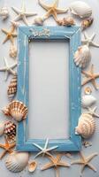 Summer time concept, wooden blue retro frame with seashells and starfish with empty space for text or image photo