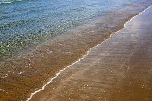The color of water in the Mediterranean Sea in shallow water. Natural abstract background. photo