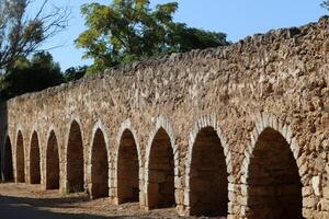 An ancient aqueduct for supplying water to populated areas. photo