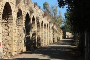 An ancient aqueduct for supplying water to populated areas. photo