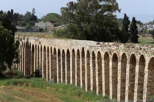 An ancient aqueduct for supplying water to populated areas. photo
