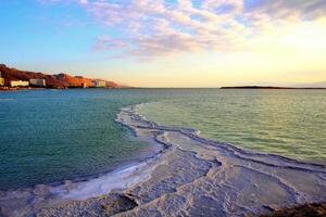 The Dead Sea is a closed, endorheic body of water in the Middle East between Israel and Jordan. photo