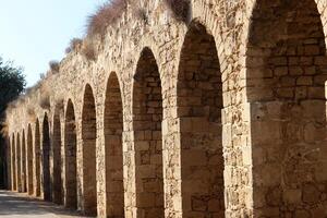 An ancient aqueduct for supplying water to populated areas. photo