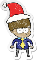 nerveux main tiré affligé autocollant dessin animé de une garçon portant chemise et attacher portant Père Noël chapeau png