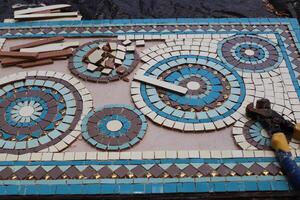 1 Ceramic marble mosaic. Concrete products covered with small ceramic tiles photo