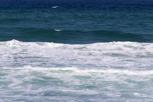 The color of water in the Mediterranean Sea in shallow water. Natural abstract background. photo