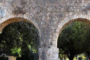 An ancient aqueduct for supplying water to populated areas. photo