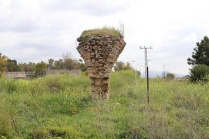 An ancient aqueduct for supplying water to populated areas. photo