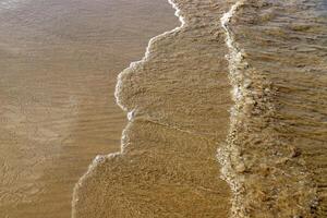 The color of water in the Mediterranean Sea in shallow water. Natural abstract background. photo