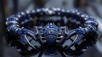 An edgy, futuristic scorpion-shaped bracelet featuring neon blue sapphires and polished silver. photo