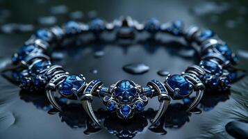 An edgy, futuristic scorpion-shaped bracelet featuring neon blue sapphires and polished silver. photo
